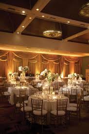 Flowers on the chairs for the ceromony decor. Pin By Wedding Spot On Quotes Wedding Reception Decorations Uplighting Wedding Wedding Lights