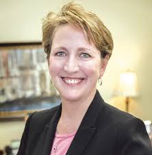 Laura Grill, president and CEO of...