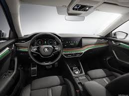 Red decorative stitching on the armrests of the front doors and the optional centre armrest. Skoda Octavia Scout 2021 Pictures Information Specs