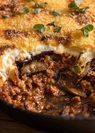 In a buttered baking dish, layer potatoes, meat, eggplant and top with parmesan. Moussaka Greek Beef And Eggplant Lasagna Recipetin Eats