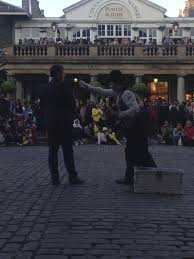 A Comedic Magician Entertaining The Crowd At Covent Garden The Magicians Street View London