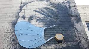 Returning to the london underground to get up his notorious rat stencils. Coronavirus Banksy S Girl With A Pierced Eardrum Given Face Mask Bbc News