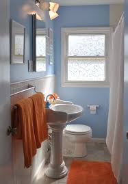 This space gains a playful edge from a patterned shower curtain and colorful bath accessories. Stunning Furniture Marvelous Orange Bathroom 50