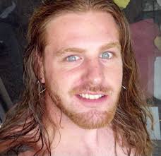 Daniel Stephens 6'1, 195, blond/blue eyes Shaved head now with small beard,  tattoo of raven