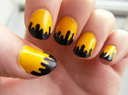 The yellow nail design looks far more adorable with those pink and purple flowers. 10 Yellow Nail Art Ideas Indian Beauty Tips