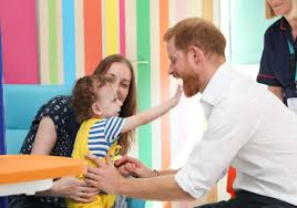 Prince harry, duke of sussex kisses his wife meghan, duchess of sussex as they leave from st. 30 Photos Of Prince Harry With Kids Prince Harry S Best Moments With Children