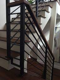 Horizontal cable railing runs from post to post above vertical 2×2 pickets in an interesting combination of metal and wood elements on this forest deck. Horizontal Black Flat Bar Railing Contemporary Staircase Calgary By Architech Stairs Railings Houzz