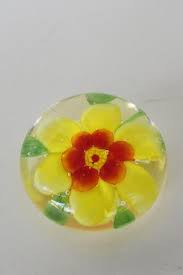 Vintage glass figurines and paperweights are highly collectible and make great gifts. Vintage Glass Paperweight Yellow Flower Daisy Encased In Clear Glass Art Glass Made In China