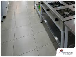 Commercial or restaurant kitchen floors are typically made of red or gray quarry tile and these porous tiles tend to trap grease and soap in the tiny holes, which results in a slippery floor surface. Pros And Cons Of Commercial Kitchen Floor Materials
