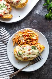 Breaded chicken covered in marinara sauce and topped with melted cheese—great served over pasta! Oven Baked Chicken Parmesan