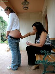 Young sweetie caned on her luscious full round ass with her legs spread