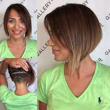 Asymmetric Inverted Bob With Side Swept Bangs And Undercut Shave Detail The Latest Hairstyles For Men And Women 2020 Hairstyleology Messy Bob Hairstyles Short Wavy Hair Hair Styles