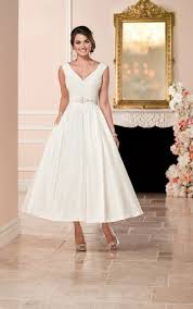 The best short and mid length wedding dresses from simple vintage inspired designs to boho or modern, including high low bridal gowns. Wedding Dresses Stella York