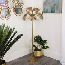 Rattan is made of the woven fronds of a type of palm tree. Large Gold Palm Tree Floor Lamp