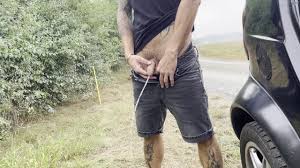 Man has to piss in the public parking lot
