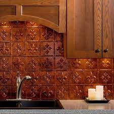Backsplash tiles are as beautiful and varied as they are practical and protective. Fasade 18 25 In X 24 25 In Moonstone Copper Fleur De Lis Pvc Decorative Tile Backsplash B66 18 The Home Depot Copper Backsplash Kitchen Backsplash Kitchen Backsplash Pictures