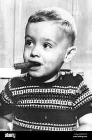 Raymond Judd Jr, 29 months old, who smokes two cigarettes a day and an  occasional cigar, Louisville, KY 6/1958 Stock Photo