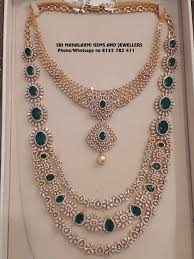 Stunning Gold Necklace And Long Haaram Studded With Diamonds And Emeralds Visit For Lates Diamond Necklace Designs Diamond Jewelry Designs Gold Jewelry Fashion
