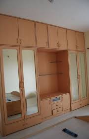 If you are looking for a cupboard design for your bedroom then using this as a reference is also an the best part about this wooden cupboard is that you can build it on the entire length of the wall to. Bedroom Wardrobe Wall Cabinets Hanging Cabinet Design For Small Bedroom Besthomish