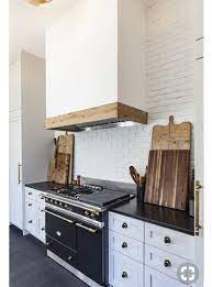 Maybe you would like to learn more about one of these? White Hood With Wood Trim Kitchen Remodel Kitchen Design Kitchen Inspirations