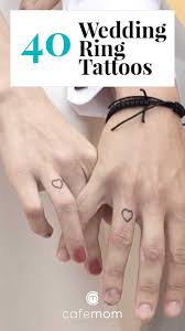 An ideal piece considering the wearer is a photographer and the index finger is visible when the wearer is the wearer's each have a half of a hear tattooed on their ring fingers so they make a complete heart when their fingers are intertwined. 40 Wedding Bands Tattoos Cafemom Com