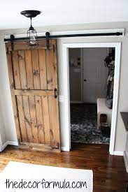 Diy Barn Doors How To Build A Sliding Barn Door For Cheap The Decor Formula Cheap Barn Doors Diy Barn Door Cheap Diy Barn Door Plans
