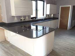 White kitchen worktops are the perfect choice for a modern scheme. Ultra Modern Gloss White Handless Kitchen With Quartz Grey Worktops White Gloss Kitchen Home Kitchens Kitchen Remodel