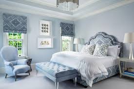 Midtone grays, such as pearl and fog, tiptoe into view as an understated showcase for industrial metals and streamlined silhouettes. Blue Bedroom With Gray Open Bedside Tables Transitional Bedroom