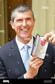 Awarded during an investiture ceremony at buckingham palace hi-res stock  photography and images