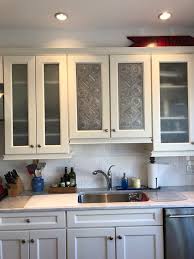 Using Pierced Tin Panels To Add A Bit Of Farmhouse Style To An Otherwise Bland Builder S Kitchen Kitchen Cabinets Kitchen Tin Panel