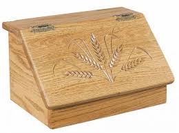 The style and design of this wood bread box will add a pleasing focal point to your kitchen counter top. Amish Made Bread Box With Carved Lid