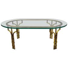 ( 4.5) out of 5 stars. Italian Hollywood Regency Faux Bamboo Oval Glass Gold Gilt Iron Coffee Table For Sale At 1stdibs