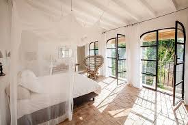 20 Interiors That Embrace The Warm Rustic Beauty Of Terracotta Tiles Mediterranean Bedroom Tile Bedroom Ibiza Style Interior