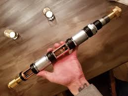 Insert into lightsaber hilt, and shake around a bit until the napkin tube expands enough to fit snuggly into the hilt. Staff Hilt Exposed Crystal Chambers Home Depot Build Lightsabers