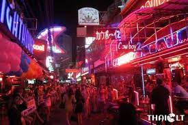 At night the street is light up by the large neon lights advertising each bar. Soi Cowboy Red Light District In Bangkok Thaiest
