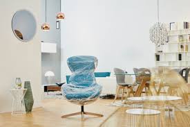 Quality furniture for the whole home. Showroom Interior Of A Furniture Shop With A Wrapped Arm Chair Stockphoto