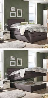 boxspringbett mit dunkelbraunem textilstoff und mit schwarzen fussen boxspringbett haus bett