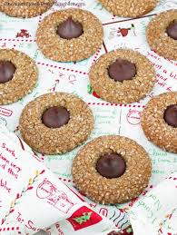 Springtime brings lots of new color, and these hershey's kisses thumbprint cookies are no exception. Hershey Kiss Gingerbread Cookies Cinnamon Spice Everything Nice Recipe Hershey Kisses Recipes Gingerbread Cookies Kisses Recipe