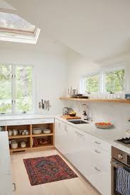 We ordered cabinets from american woodmark in the ashland style with linen paint. A Fashion Buyer S Danish Inspired Getaway On Shelter Island Before And After Remodelista Home Kitchens Kitchen Interior Kitchen Remodel