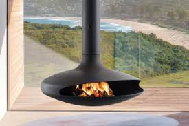 Log burners run cleaner when burning at higher temperatures and this tube created a vortex which caused the flames to fill the whole of the upper half of the fire box. Suspended Modern Fireplaces Floating Fireplaces European Home