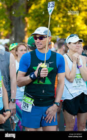 Eugene, OR, USA. 1st May, 2016. Race pacer Jerry Mark holds the 3:35 pace  flag at the 2016 Eugene Marathon a USATF sanctioned Boston qualifier in  Eugene, OR. Joshua Rainey/Alamy Live News