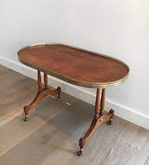 Midcentury oval coffee tables fashioned from wood strike a nice balance, as they'll add warmth to the room without feeling overbearing. Small Coffee Table Oval Neoclassical Wooden Brass Around 1940 Low Table