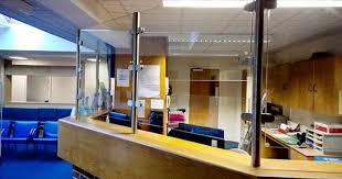 Glass Desk Security Screens This Glass Security Screen Not Only Protects The Reception Staff From P Reception Desk Glass Reception Desk Medical Office Design