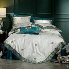 This cute bedroom is already pretty in itself with all the navy blue and gold trimmings in it. Vintage Shabby Chic Dark Teal Gold And White Embroidered Seashell Luxury Villa Adults Pima Cotton Full Luxury Bedspreads Bed Linens Luxury Luxury Bedding Sets