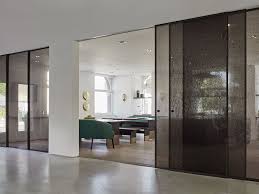 Aladin Sliding Doors Designed By Piero Lissoni In The Avenue Road Showroom Toronto Dark Brown Anodised Aluminum Frame And Extra Light Glass Panels With F