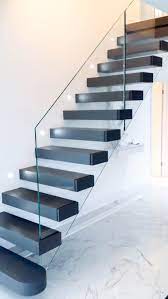 A Luxurious Staircase For A Luxurious Property Floating Treads Crafted In Wood Stained Black Add Some Stairs Design Modern Modern Staircase Floating Staircase