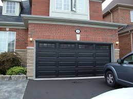 A Black Door Is A Bold Statement To Be Sure But It Can Be Exactly The Statement That Your Home Needs House Paint Exterior Exterior Brick Garage Door Colors