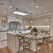 Kitchen island with seating for one person. 35 Stainless Steel Kitchen Islands That Will Bring Functionality To Your Home Curved Kitchen Island Kitchen Island Design Kitchen Island With Seating