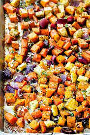 Roasted Root Vegetables On A Baking Tray With Beets Carrots Sweet Potatoes Parsnips And Butternut Sq Roasted Root Vegetables Root Vegetables Recipes Recipes