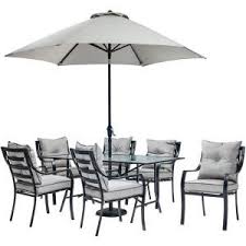 Hanover Lavallette 7 Piece Glass Top Rectangular Patio Dining Set With Umbrella Base And Silver Linings Cushions Lavdn7pc Su The Home Depot Patio Furniture Dining Set Patio Furniture Sets Table Umbrella